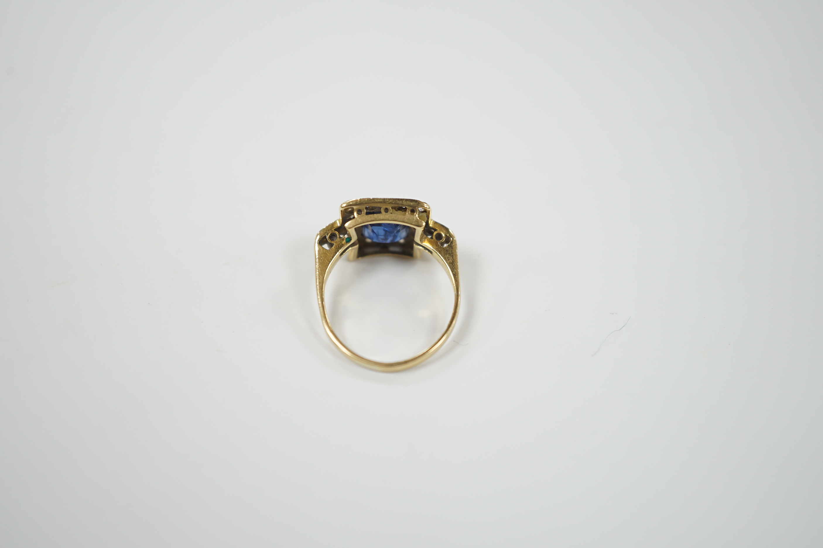 A 1940's/1950's 18ct gold & platinum, sapphire and diamond cluster set tablet ring, with diamond set shoulders, size G, gross weight 2.6 grams.